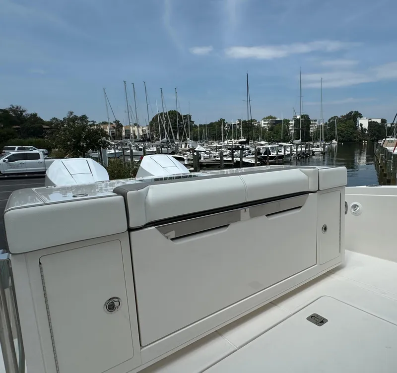 Slide: The Image of 2025 Tiara Yachts 34 LS at marina, showcasing sleek design and luxury features. - 12