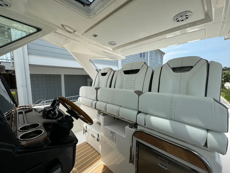 Slide: The Image of 2025 Tiara Yachts 34 LS interior with luxurious seating and modern helm design. - 16