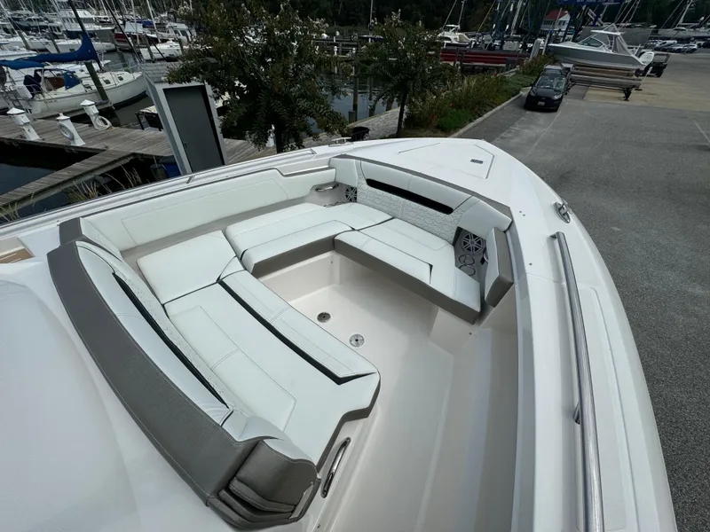 Slide: The Image of 2025 Tiara Yachts 34 LS boat with spacious seating at marina. - 22