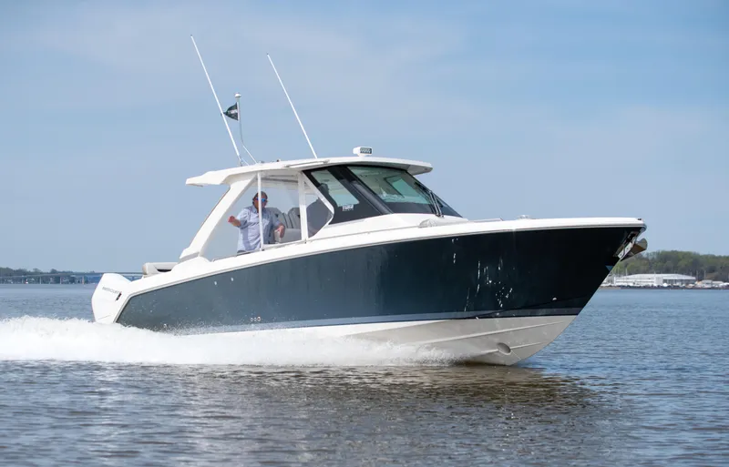 Slide: The Image of 2025 Tiara Yachts 34 LS cruising on open water. - 7