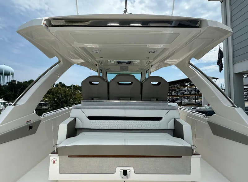 Slide: The Image of 2025 Tiara Yachts 34 LS luxury boat interior with seating and canopy. - 9