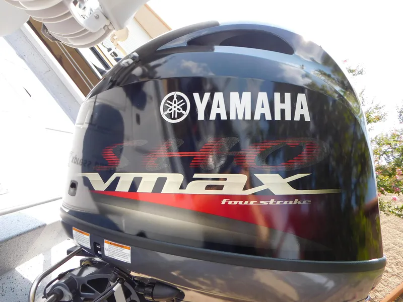 Slide: The Image of Yamaha VMAX four-stroke outboard motor, sleek design, 2025 Express h17C model. - 11
