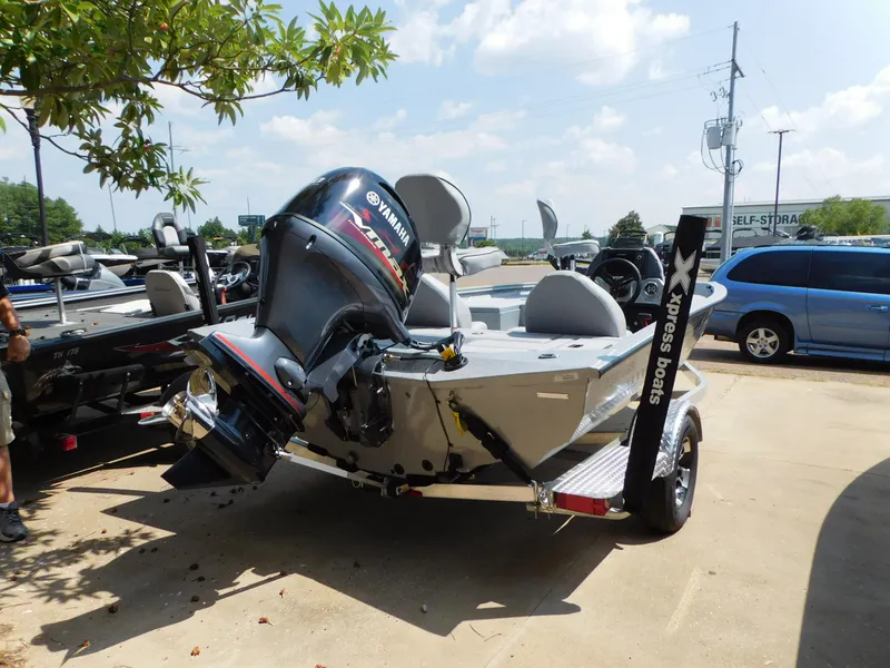 Slide: The Image of 2025 Express h17C boat with Yamaha motor in parking lot. - 3