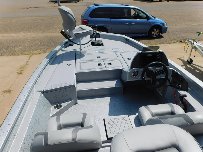 Slide: The Image of 2025 Express h17C boat interior with seating and steering console. - 4