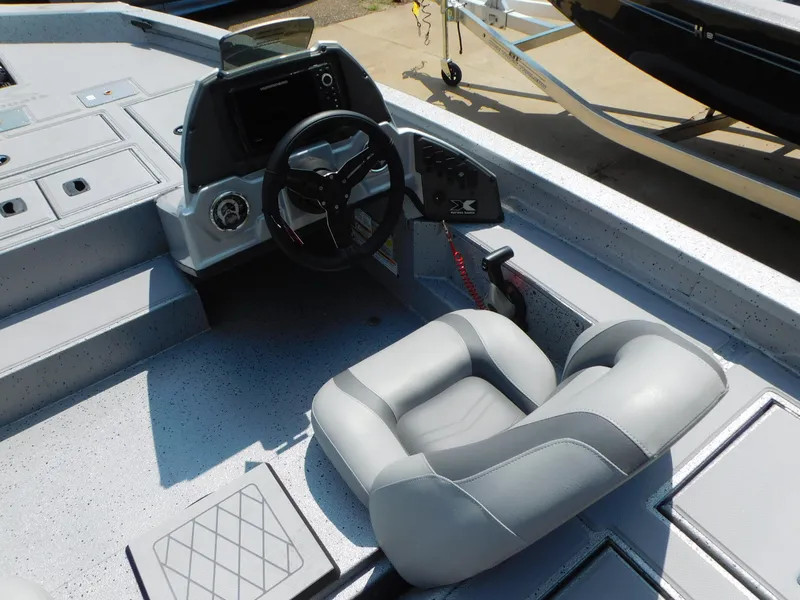Slide: The Image of 2025 Express h17C boat interior with steering wheel and cushioned seat. - 7