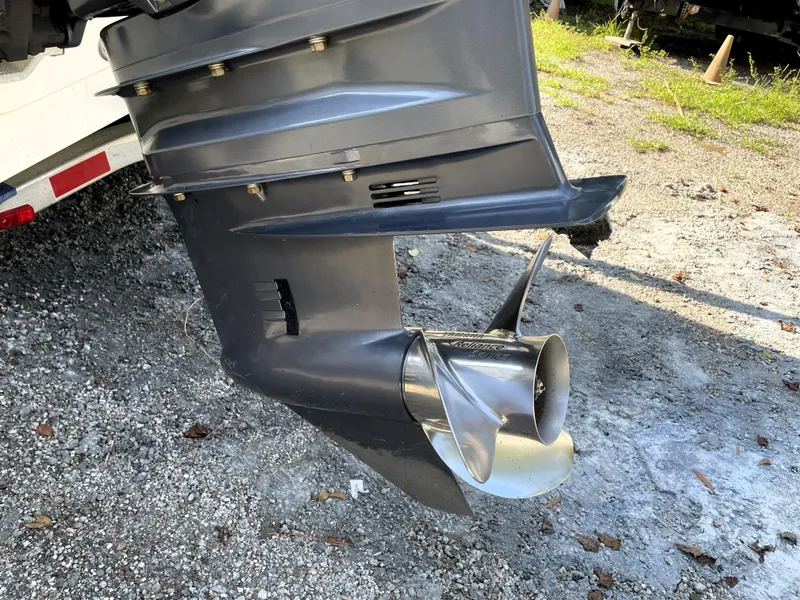 Slide: The Image of Outboard motor propeller of a 2021 Pathfinder 2005 TRS on gravel surface. - 16