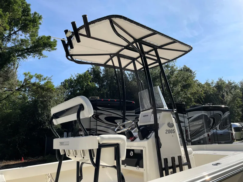 Slide: The Image of Pathfinder 2005 TRS boat with T-top and seating, parked outdoors, 2021 model. - 19