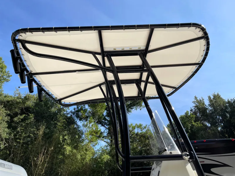Slide: The Image of T-top canopy of a 2021 Pathfinder 2005 TRS boat against a clear blue sky. - 20