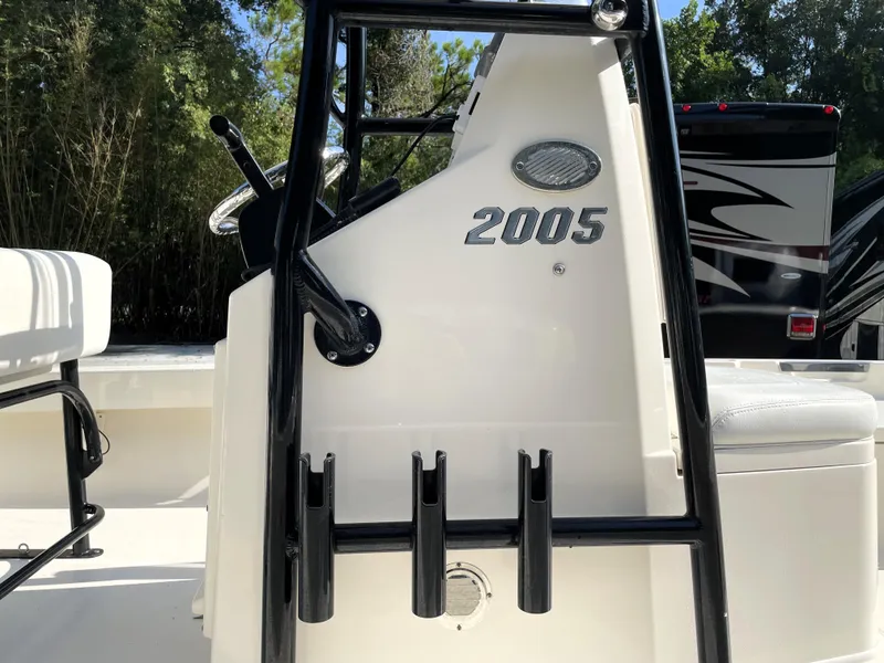 Slide: The Image of Pathfinder 2005 TRS boat console with rod holders, photographed outdoors in 2021. - 21