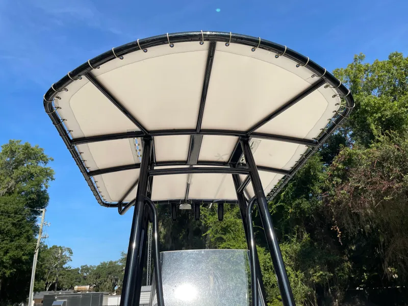Slide: The Image of T-top canopy of a 2021 Pathfinder 2005 TRS boat against a clear blue sky. - 31
