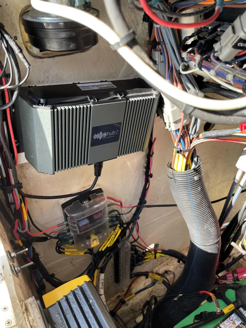 Slide: The Image of Electrical system inside a 2021 Pathfinder 2005 TRS boat, featuring wiring and components. - 35