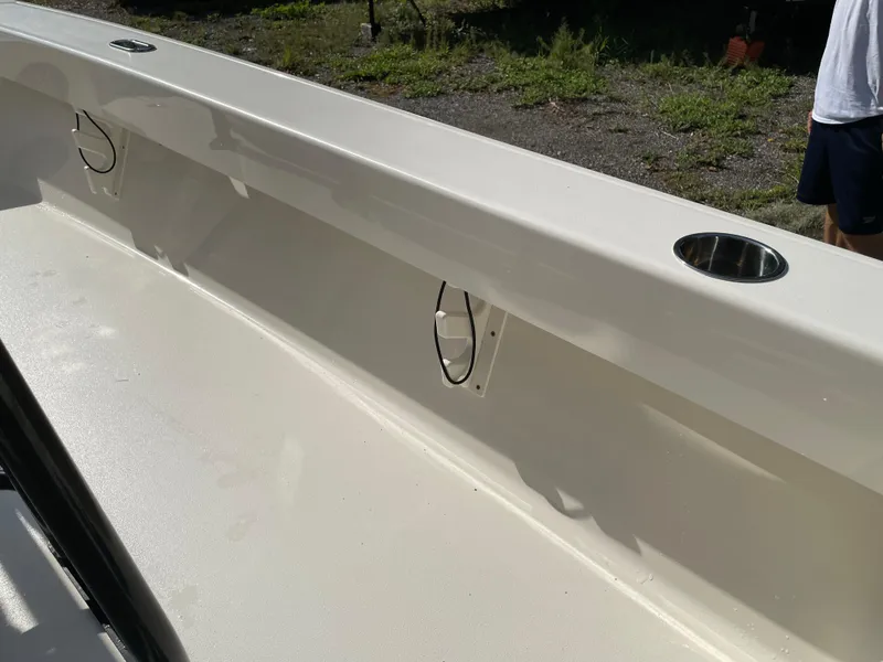 Slide: The Image of Interior view of a 2021 Pathfinder 2005 TRS boat, featuring rod holders and cup holders. - 49