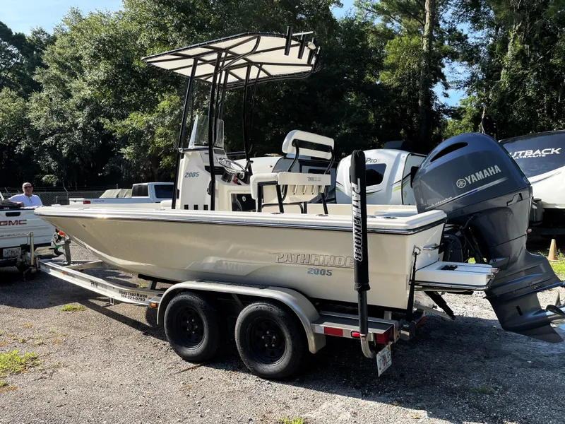 Slide: The Image of Pathfinder 2005 TRS boat on trailer with Yamaha engine, parked outdoors. - 7