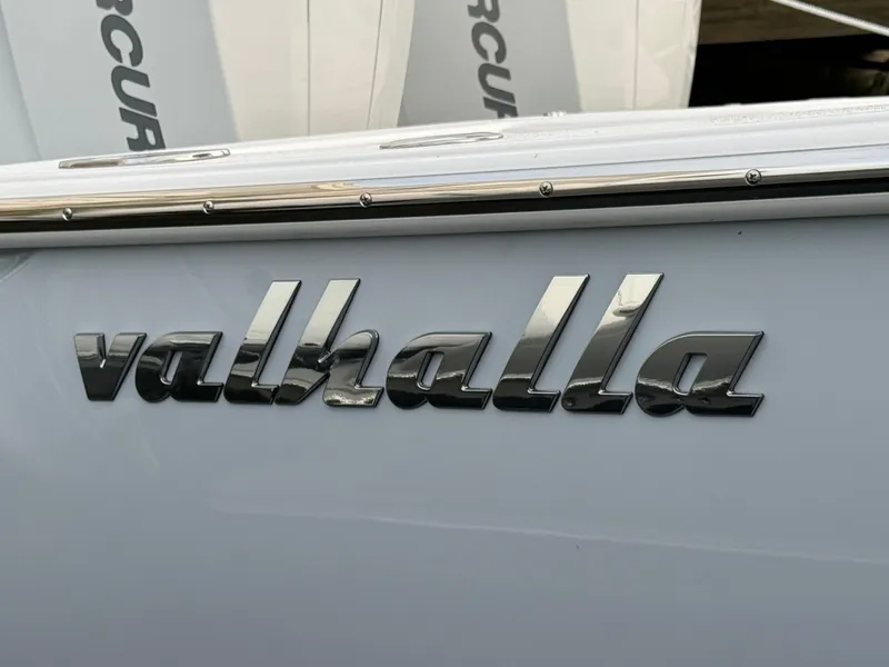 Slide: The Image of Valhalla Boatworks V-33 2025 model nameplate on boat exterior. - 14