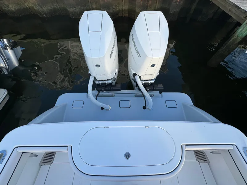 Slide: The Image of 2025 Valhalla Boatworks V-33 with twin Mercury outboard engines at dock. - 16