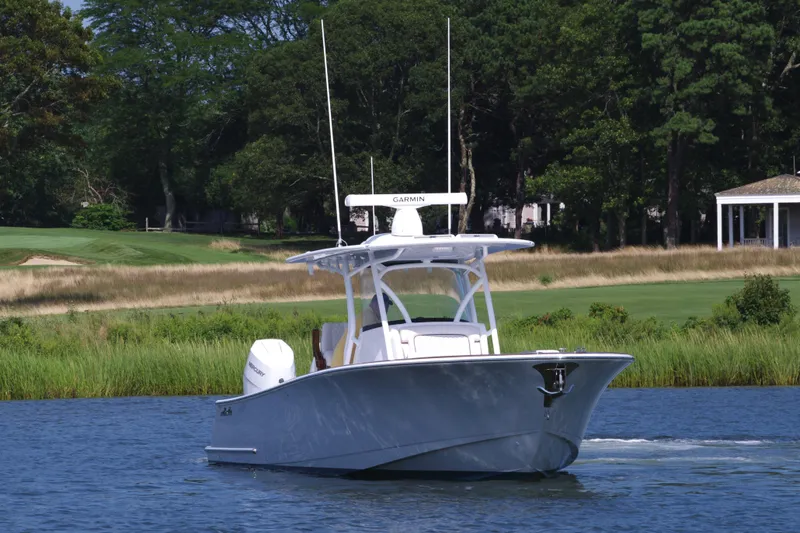 Slide: The Image of 2025 Valhalla Boatworks V-33 cruising on a serene lake. - 2