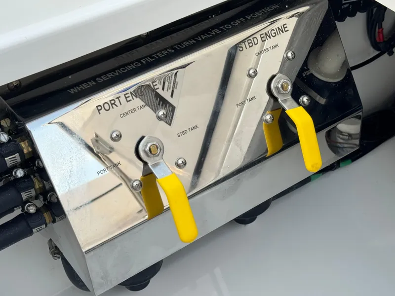 Slide: The Image of Valhalla Boatworks V-33 2025 engine controls with yellow levers and labeled ports. - 20
