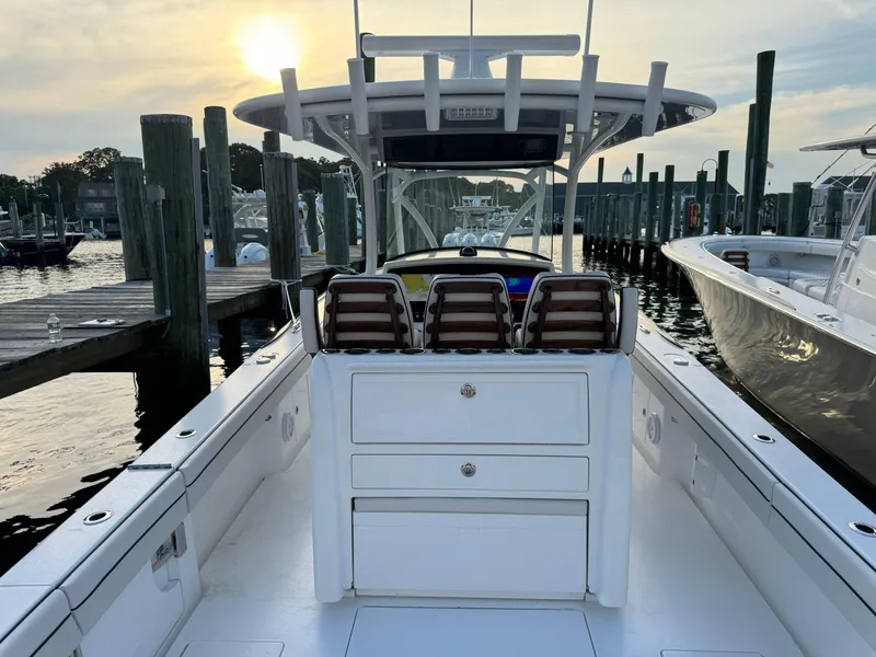 Slide: The Image of 2025 Valhalla Boatworks V-33 at marina, sunset view, sleek design, spacious deck. - 21