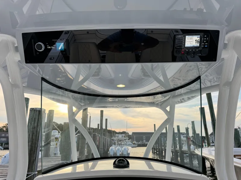 Slide: The Image of 2025 Valhalla Boatworks V-33 helm view at marina during sunset. - 29
