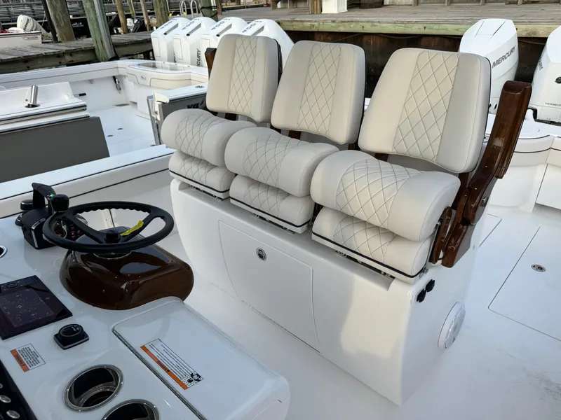 Slide: The Image of 2025 Valhalla Boatworks V-33 interior with luxurious seating and modern helm controls. - 31