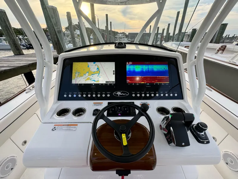 Slide: The Image of Valhalla Boatworks V-33 2025 helm with advanced navigation displays and controls. - 36