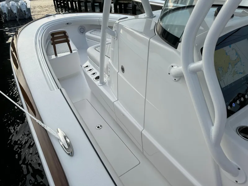 Slide: The Image of 2025 Valhalla Boatworks V-33, sleek white deck, modern design, docked by the water. - 41