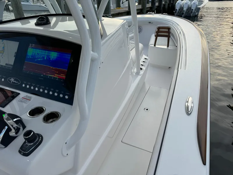 Slide: The Image of 2025 Valhalla Boatworks V-33 with advanced navigation system, docked by the water. - 42