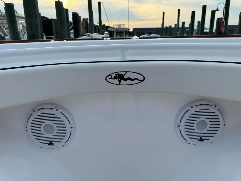 Slide: The Image of Valhalla Boatworks V-33 2025 model with dual speakers, docked at sunset. - 45
