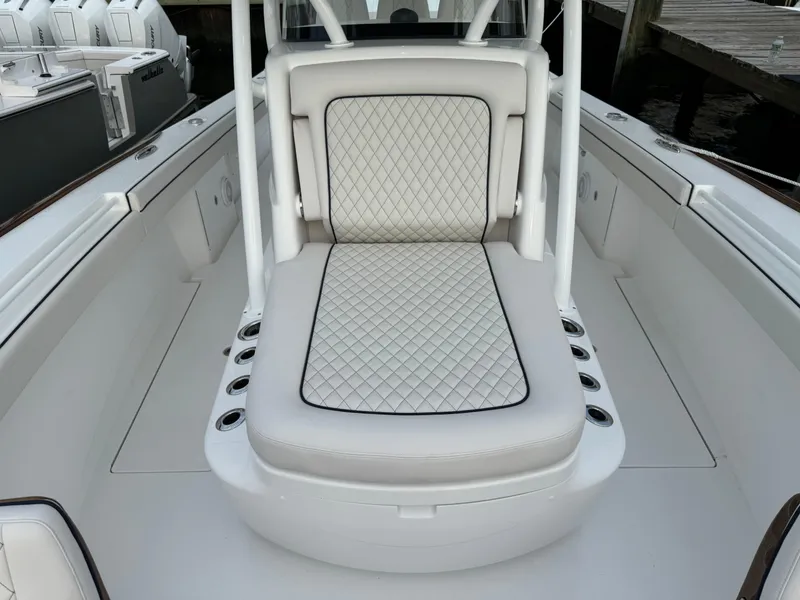 Slide: The Image of 2025 Valhalla Boatworks V-33 interior with diamond-stitched seating and sleek design. - 48