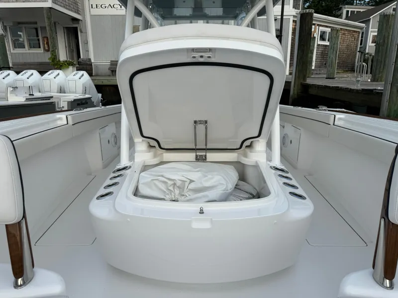 Slide: The Image of 2025 Valhalla Boatworks V-33 open storage compartment on deck, docked at marina. - 49
