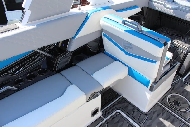 Slide: The Image of 2024 Tigé Ultré 25ZX boat interior with modern seating and sleek design. - 11