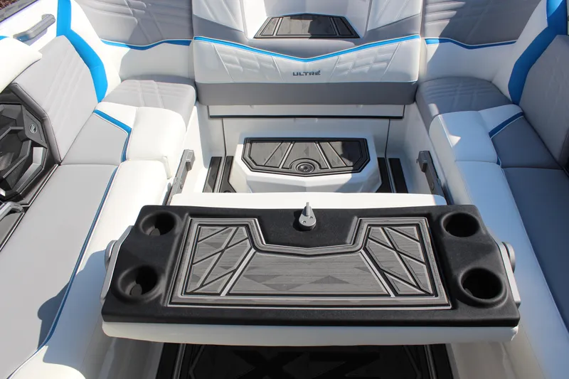 Slide: The Image of 2024 Tigé Ultré 25ZX boat interior with stylish seating and cup holders. - 20