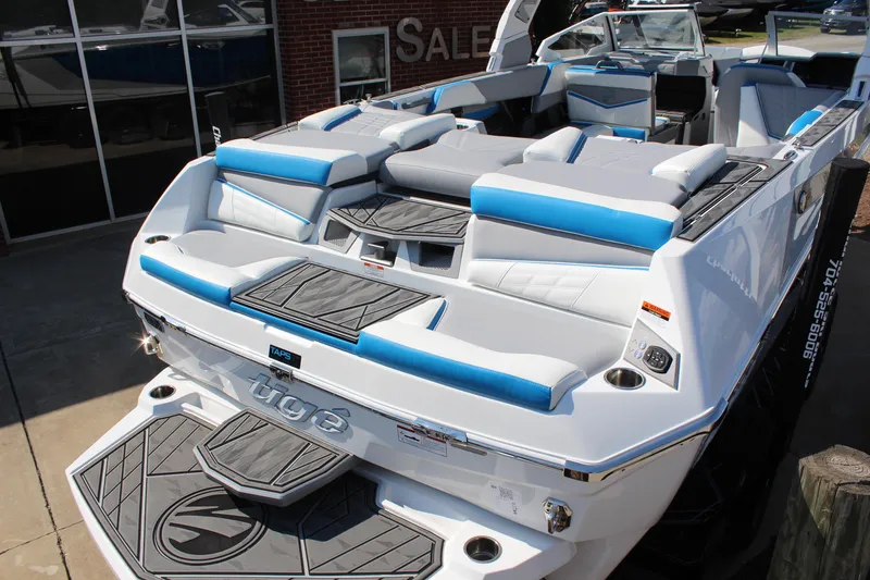 Slide: The Image of 2024 Tigé Ultré 25ZX boat with sleek design and blue accents. - 6