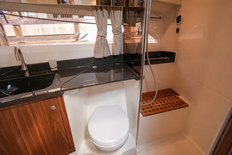 Slide: The Image of Modern bathroom in 2025 Marex 360 Cabriolet Cruiser with sleek design and wooden accents. - 21