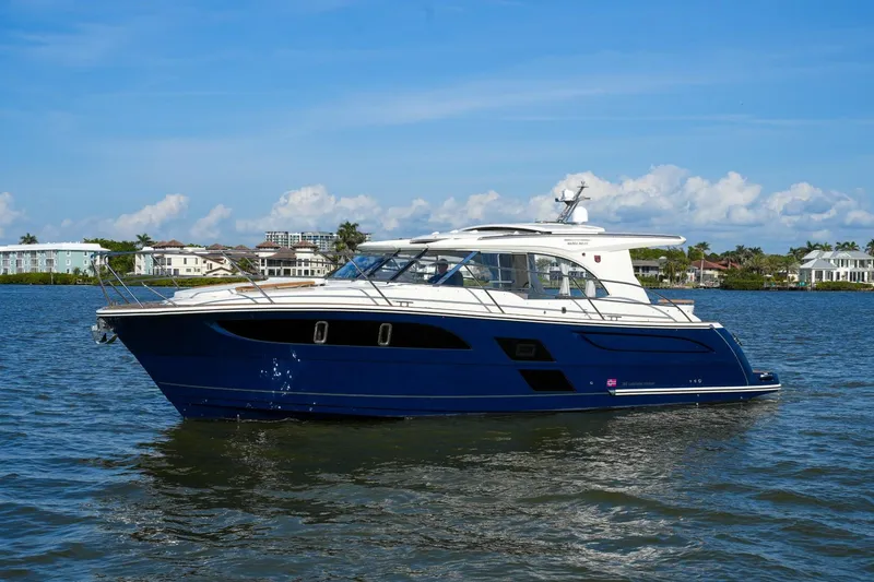 Slide: The Image of 2025 Marex 360 Cabriolet Cruiser on calm water, showcasing sleek design and luxury features. - 5