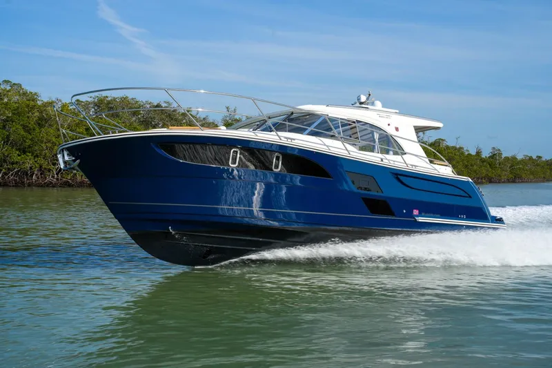 Slide: The Image of 2025 Marex 360 Cabriolet Cruiser navigating calm waters, showcasing sleek design and luxury. - 3