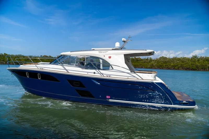 The Image of 2025 Marex 360 Cabriolet Cruiser on serene water, showcasing sleek design and luxury features. - 0