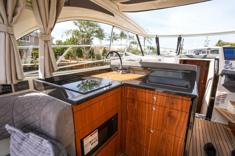 Slide: The Image of Luxurious 2025 Marex 360 Cabriolet Cruiser interior with modern kitchen amenities. - 18