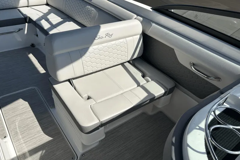 Slide: The Image of 2022 Sea Ray 270 Sundeck Outboard interior with luxurious seating and modern design. - 10