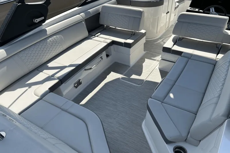Slide: The Image of 2022 Sea Ray 270 Sundeck Outboard interior with spacious seating and modern design. - 11