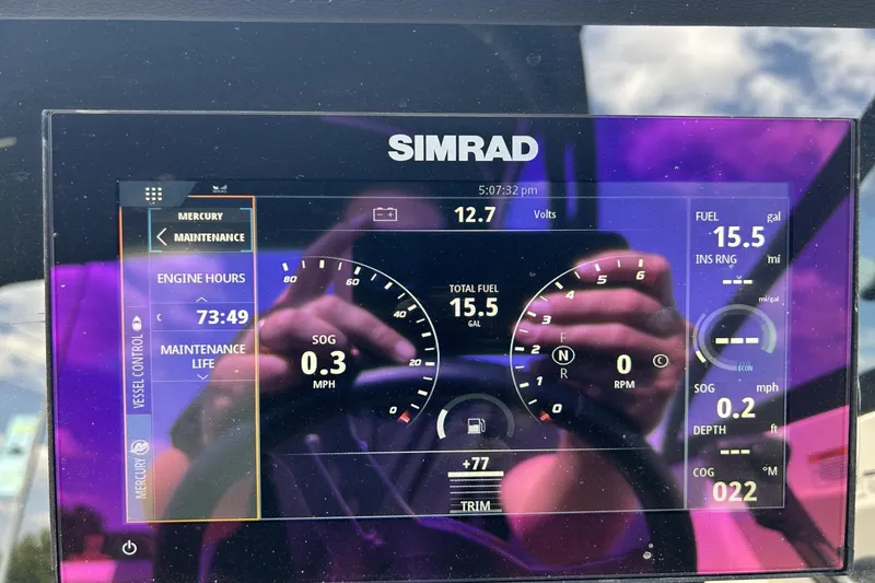 Slide: The Image of Simrad display on 2022 Sea Ray 270 Sundeck Outboard showing engine and fuel data. - 13