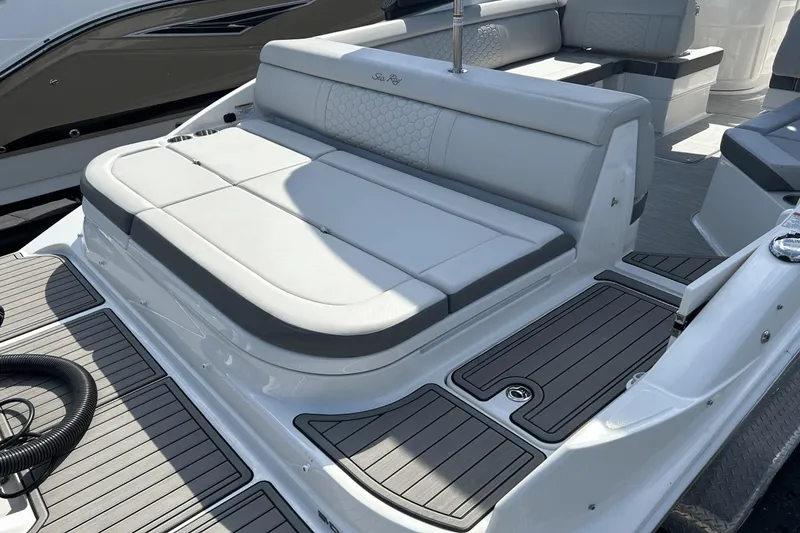 Slide: The Image of 2022 Sea Ray 270 Sundeck Outboard with spacious seating and sleek design. - 4