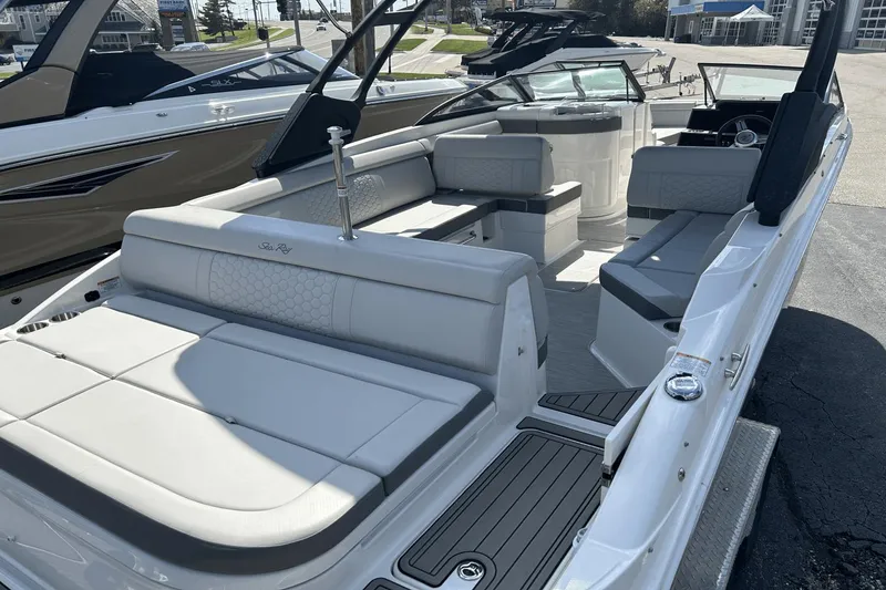 Slide: The Image of 2022 Sea Ray 270 Sundeck Outboard with spacious seating and sleek design. - 5