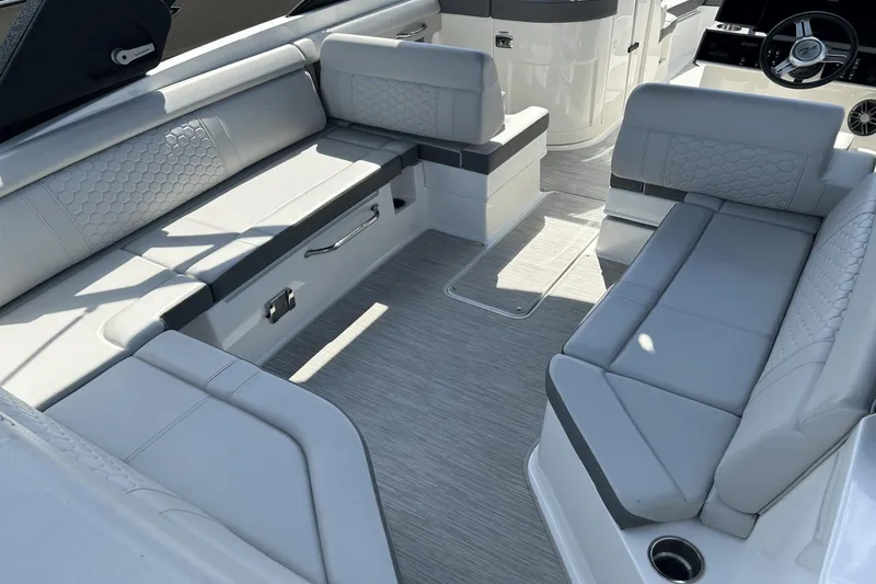 Slide: The Image of 2022 Sea Ray 270 Sundeck Outboard interior with spacious seating and modern design. - 7
