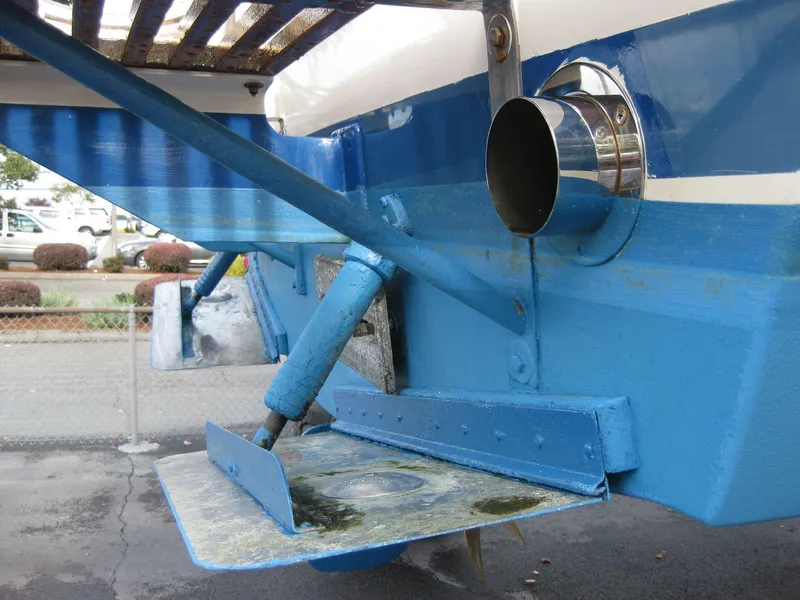 Slide: The Image of 1977 Chris-Craft 28' Cruiser stern detail with blue trim and exhaust pipe. - 10