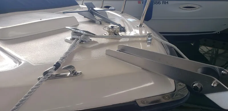 Slide: The Image of 1977 Chris-Craft 28' Cruiser deck with cleats and rope details. - 11