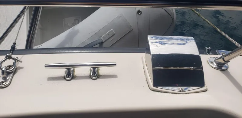 Slide: The Image of 1977 Chris-Craft 28' Cruiser deck with chrome fittings and cleat. - 13
