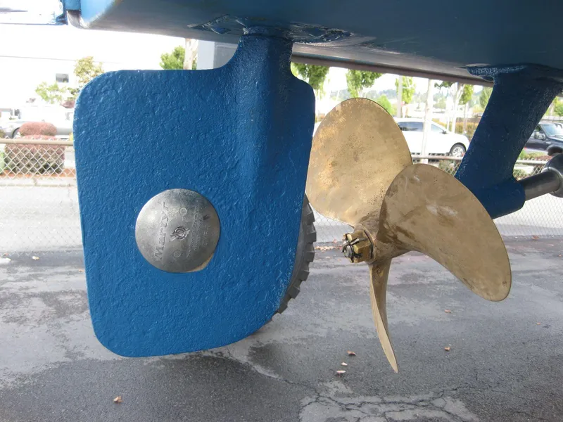 Slide: The Image of 1977 Chris-Craft 28' Cruiser propeller and rudder detail, showcasing marine engineering. - 19