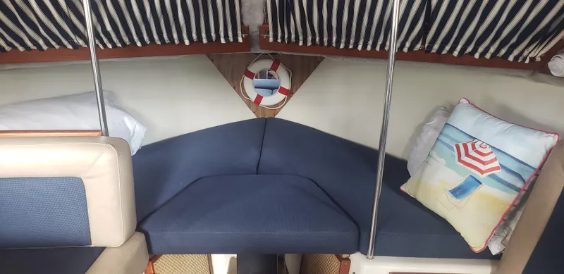 Slide: The Image of Interior of 1977 Chris-Craft 28' Cruiser with nautical decor and striped cushions. - 21