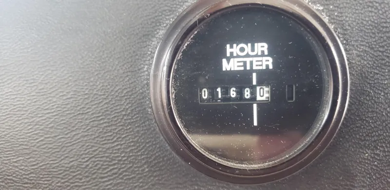 Slide: The Image of Hour meter showing 1680 hours on 1977 Chris-Craft 28' Cruiser. - 34